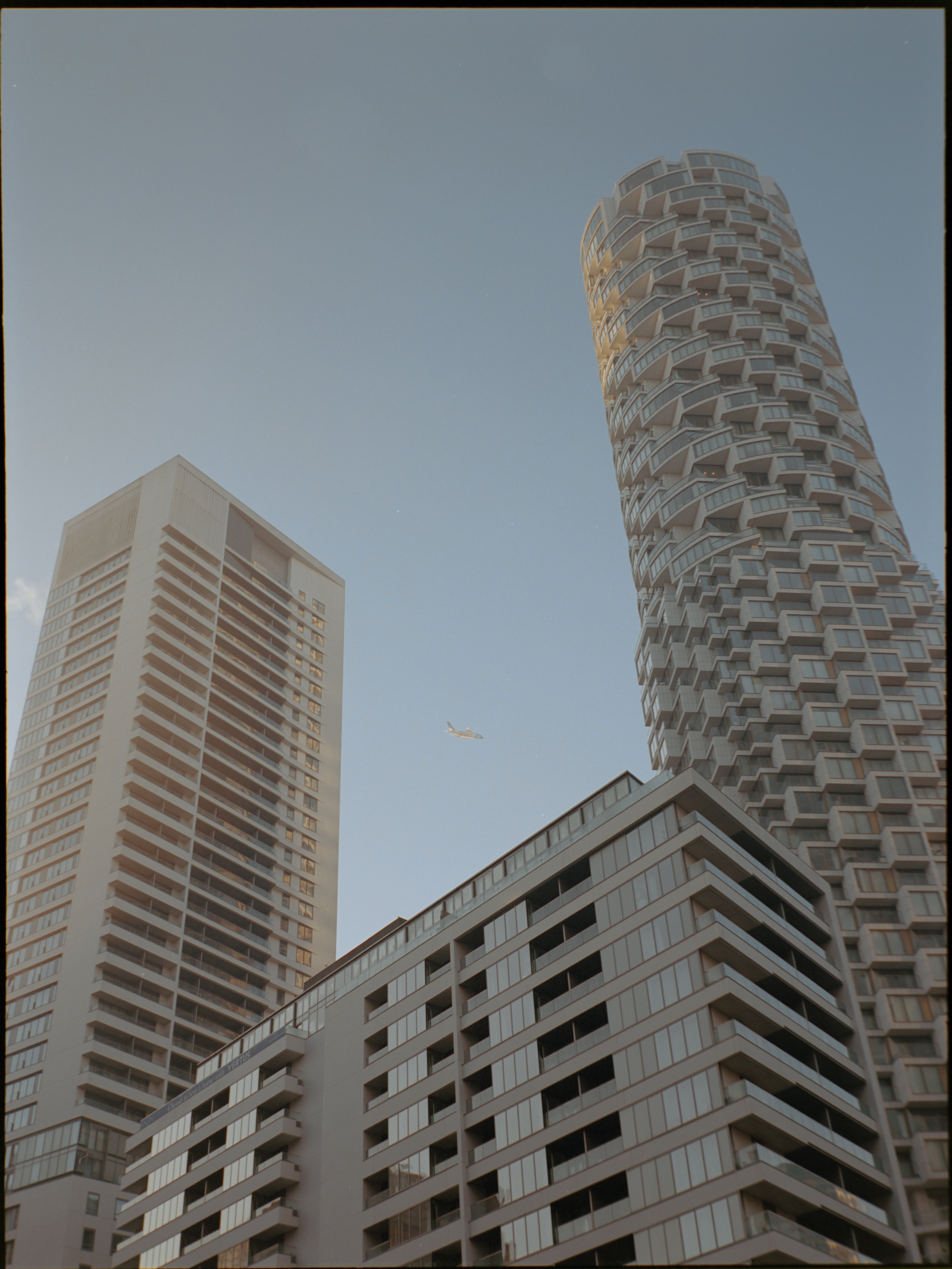 Urban scene with modern architecture and pedestrian in Canary Wharf — Portra 160 medium format