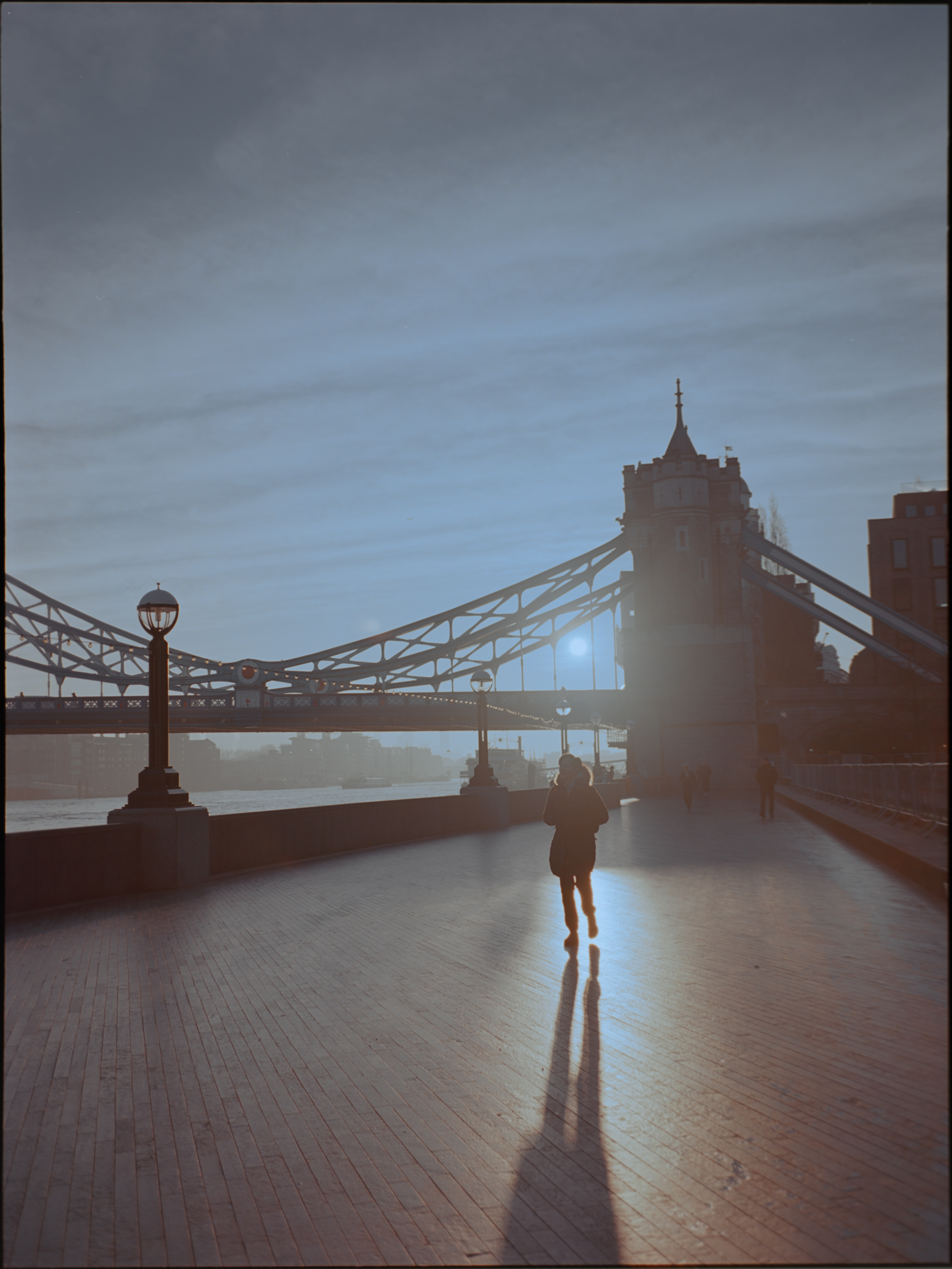 Silhouette walking toward Tower Bridge at sunrise — Kodak Ektar 100 on Fujifilm GA645S
