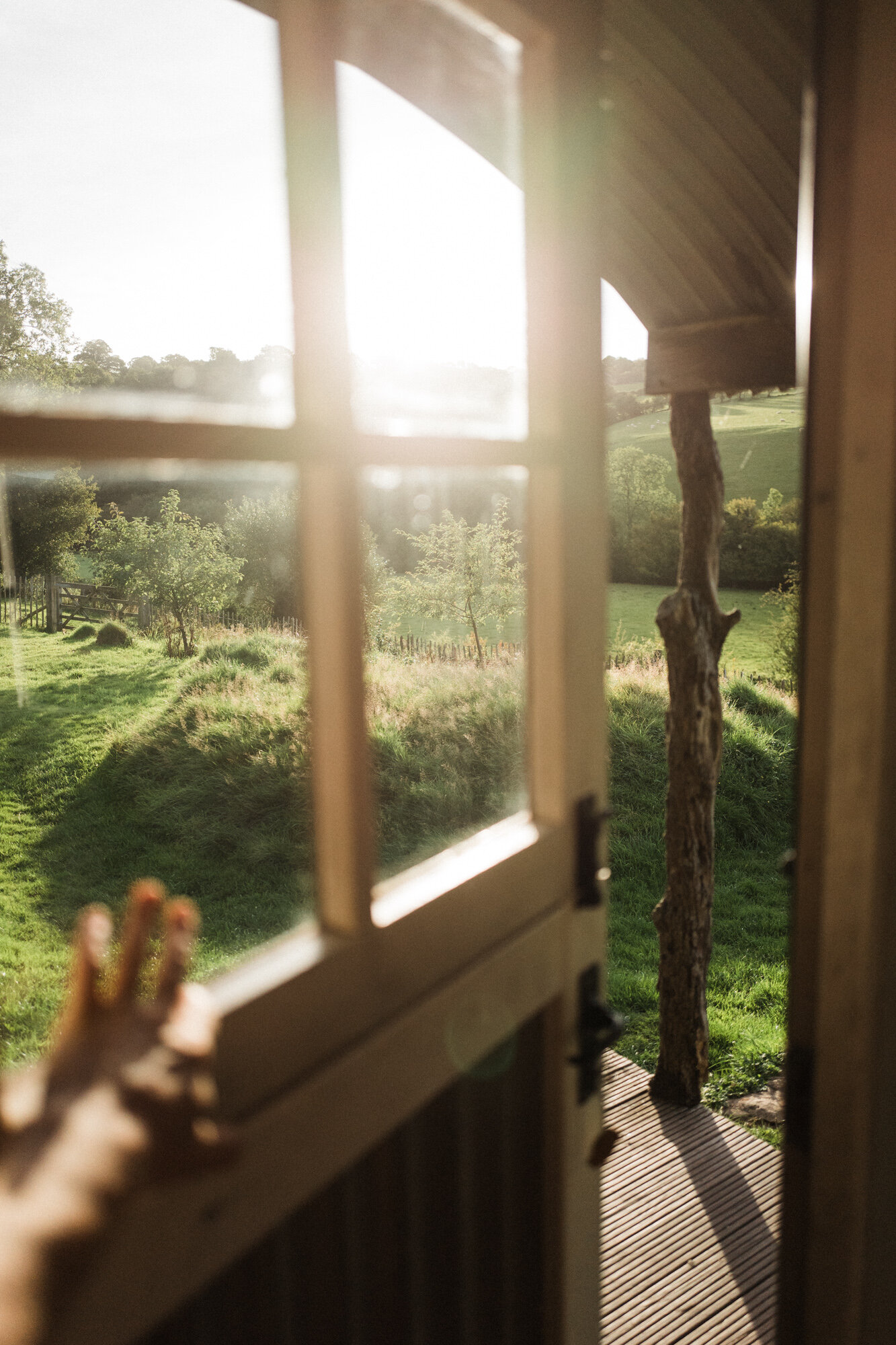 shepherds hut window golden morning light lifestyle photographer london