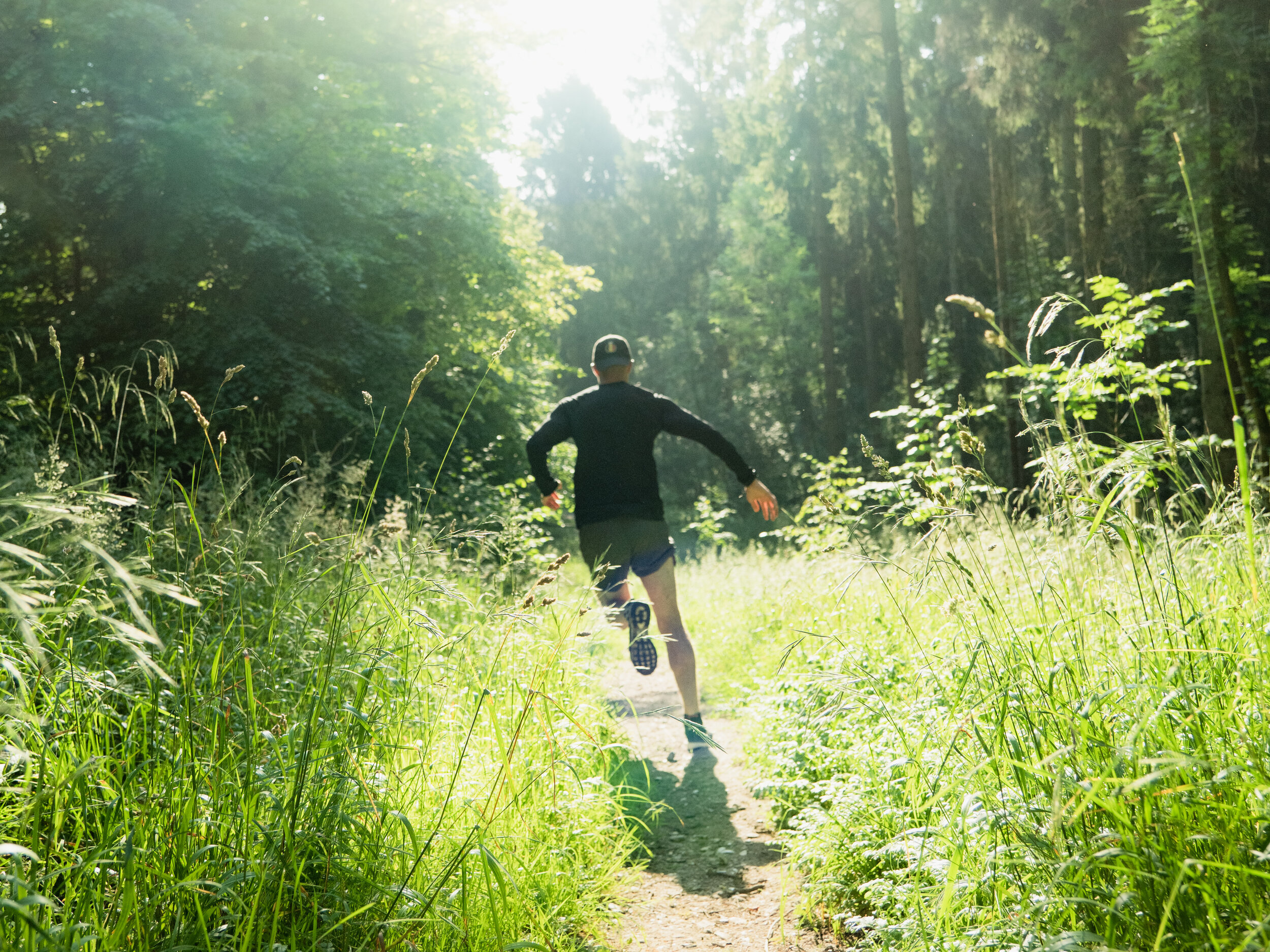 solo trail runner forest path lifestyle photographer london