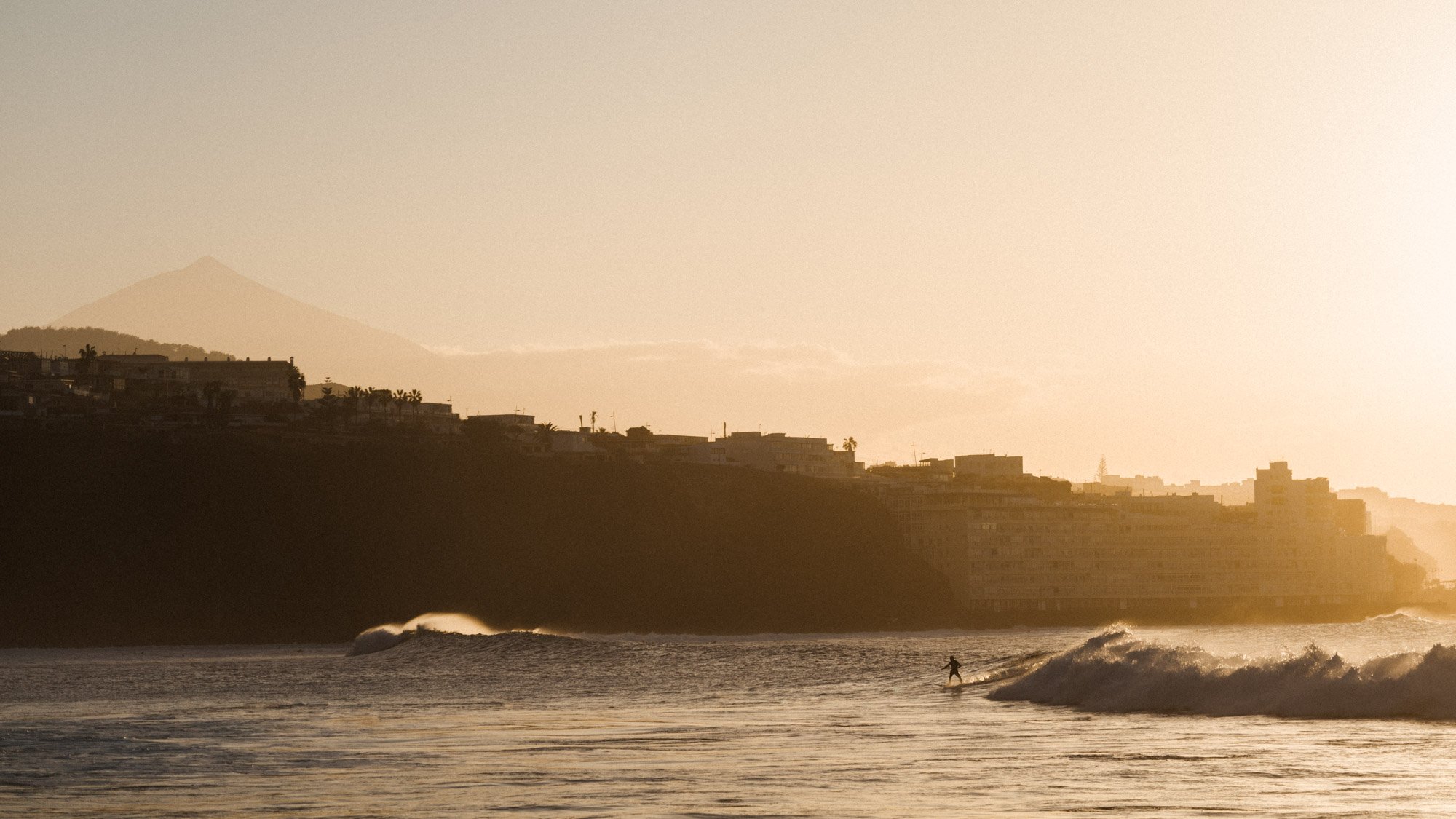 Surfer wave Tenerife coastal town lifestyle photography