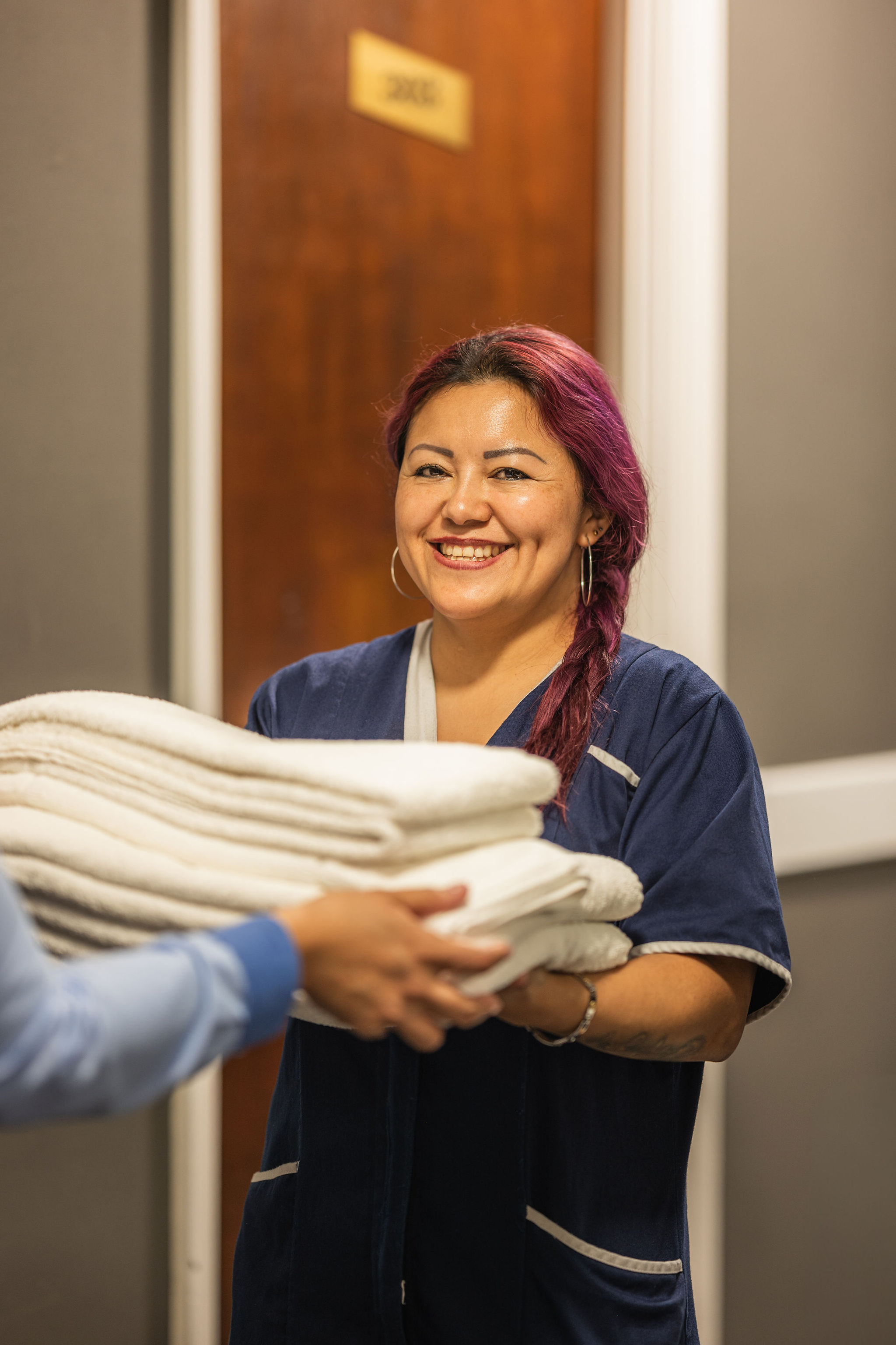 Hotel front desk staff portrait London